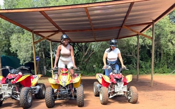 Title: Two women on quad bikes with helmets at a Johannesburg quad biking venue β Uzoefu experience 2026 - Description: Two women on quad bikes with helmets at a Johannesburg quad biking venue β Uzoefu experience 2026